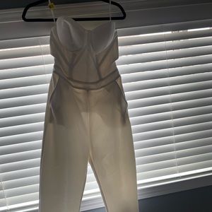 White, bebe strapless jumpsuit size small